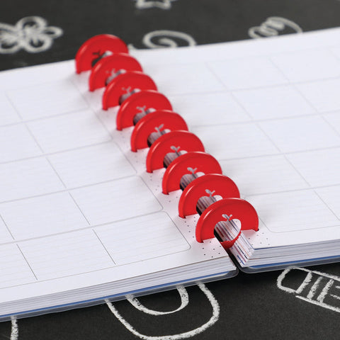 Image of Lifestyle shot of the apple cut out discs inserted into a planner