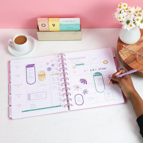 Image of A lifestyle shot of the Retro Daisy Big 12 month Planner by Happy Planner