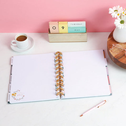 Image of A Lifestyle shot of the Cottagecore Florals Big Fill Paper inserted into a Happy Planner