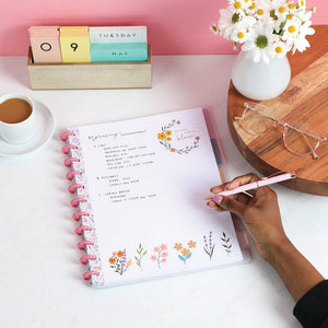 Lifestyle shot of the Subtle Sophisticated big notebook by Happy Planner