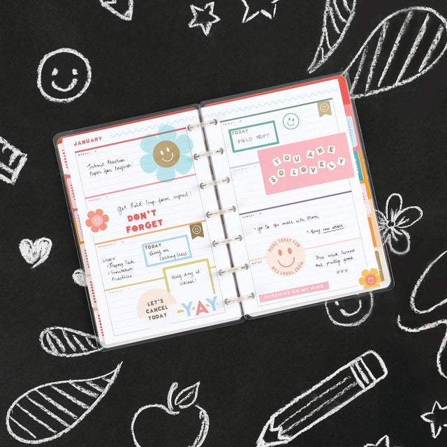 A lifestyle shot of the Super Happy Mini 12 month planner by Happy Planner