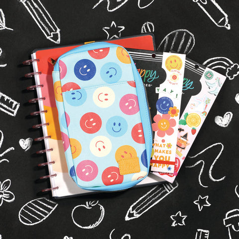 Image of A lifestyle shot of the Super Happy Sticker Folio by Happy Planner.